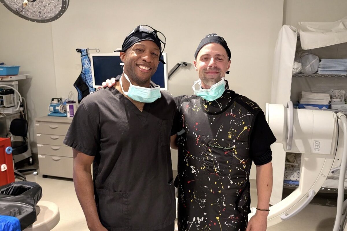 Dylan Gaar and clinical advisor in neuromodulation procedure environment